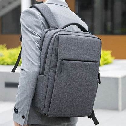 Sac a dos ordinateur portable gris sur dos
